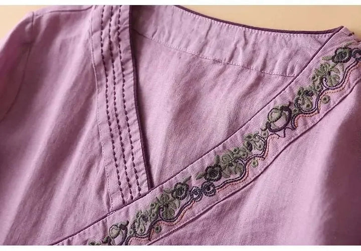 Women's embroidered V-neck blouse, patterned, relaxed fit. Stylish & comfortable for casual.