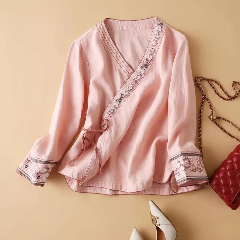 Embroidered women's patterned blouse, V-neck, relaxed fit. Chic & versatile casual wear top.
