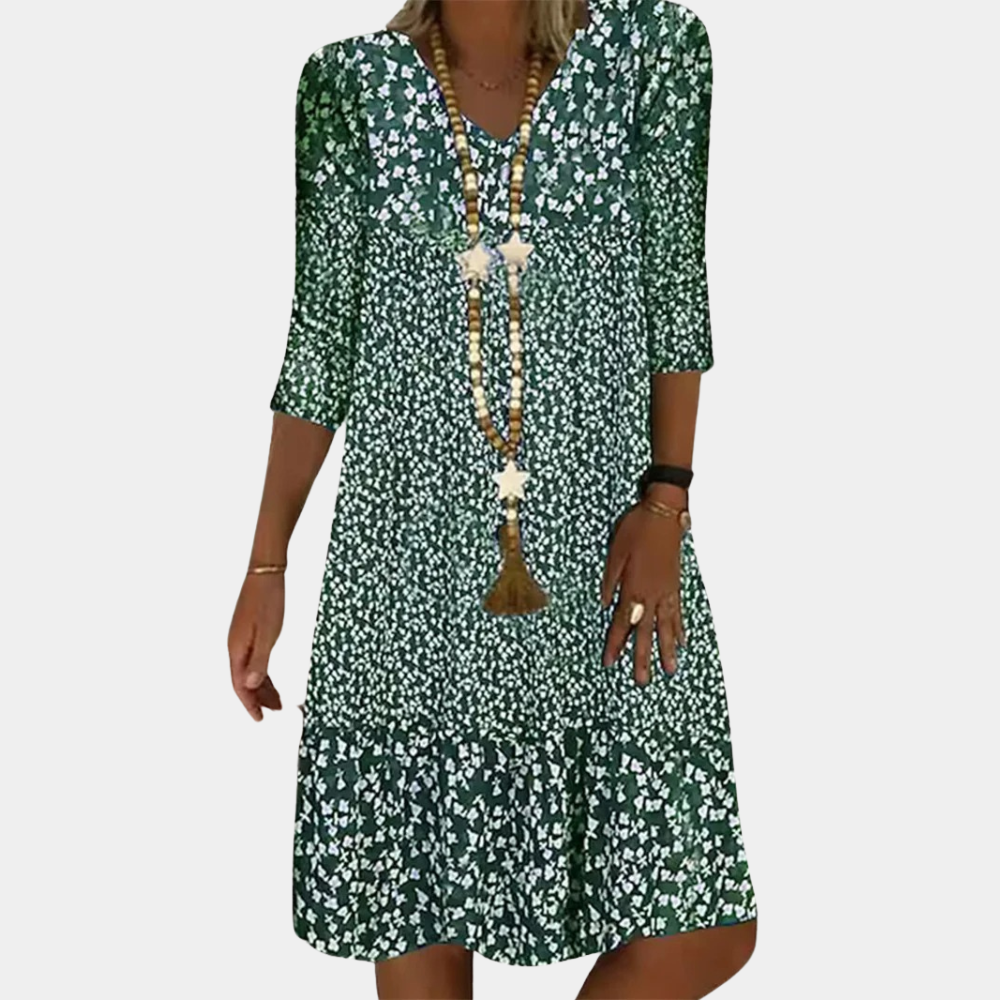 Stylish women's printed A-line midi dress featuring a flattering V-neck and comfortable 3/4 sleeves. Casual & elegant.