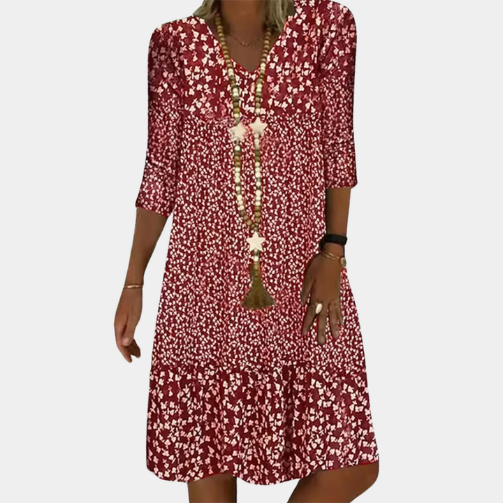 Flowy women's printed midi dress with a comfortable A-line fit. Features a stylish V-neck and 3/4 sleeves, ideal for summer.