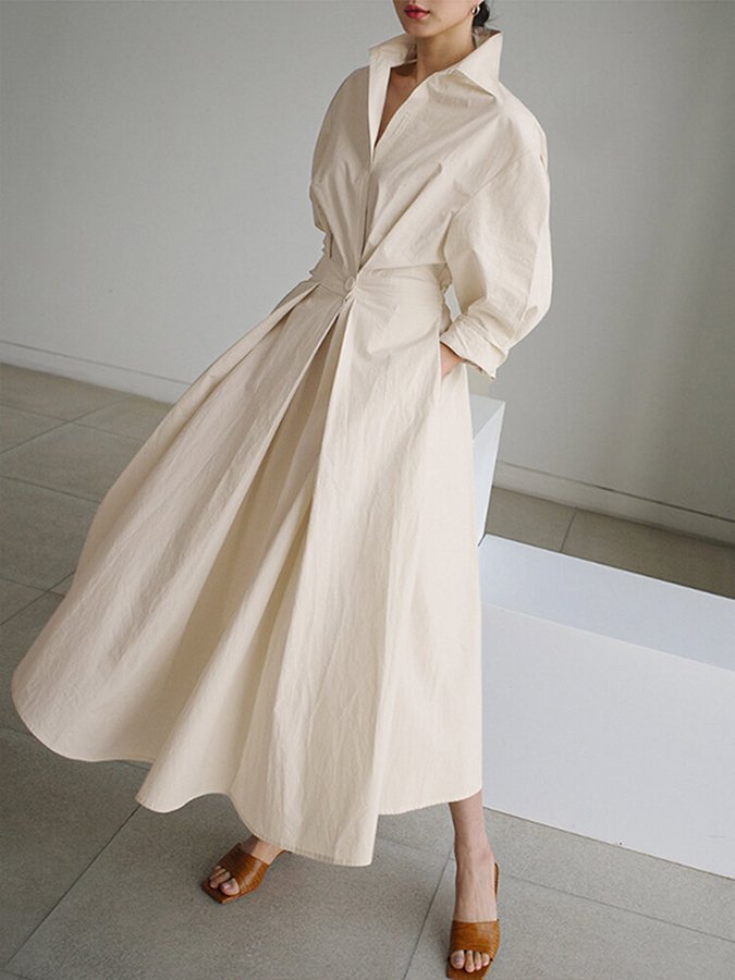 Casual women's maxi dress featuring puff sleeves, twist waist, & V-neck; perfect for summer style.