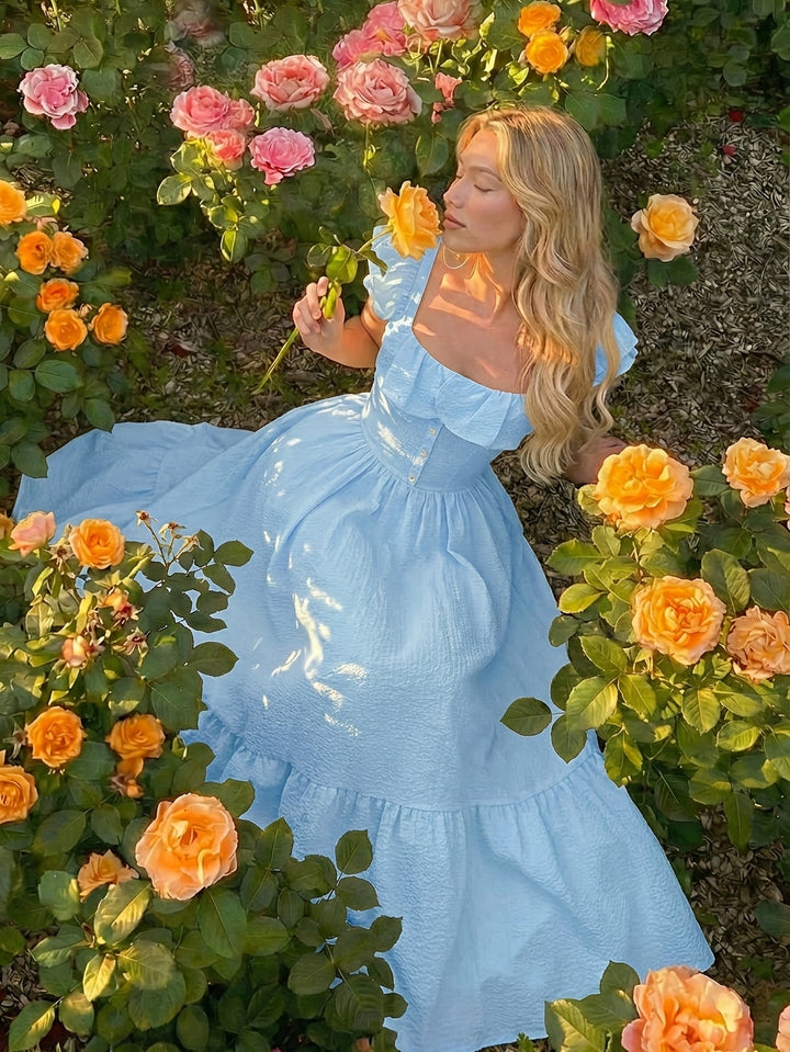 Beautiful women's off-shoulder maxi dress with elegant ruffles, suitable for summer and parties.