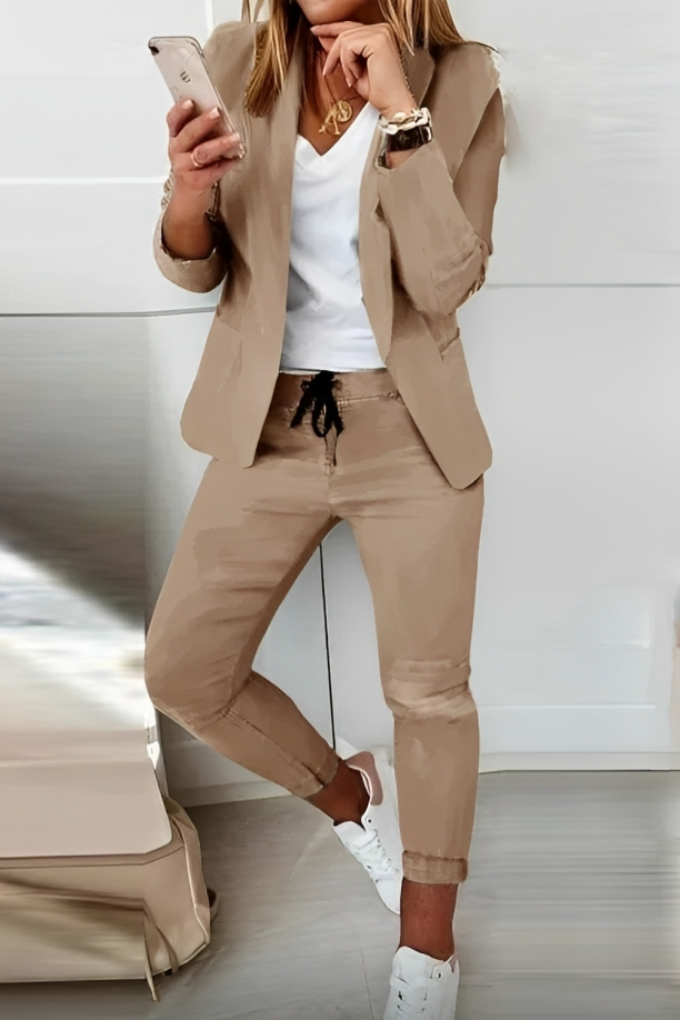 Professional women's two-piece blazer and pants set, ideal for office wear, business meetings, and corporate events.