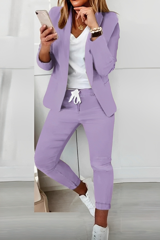 Modern women's two-piece blazer & pants set. Versatile fashion for business casual, professional wear, and any special occasion.