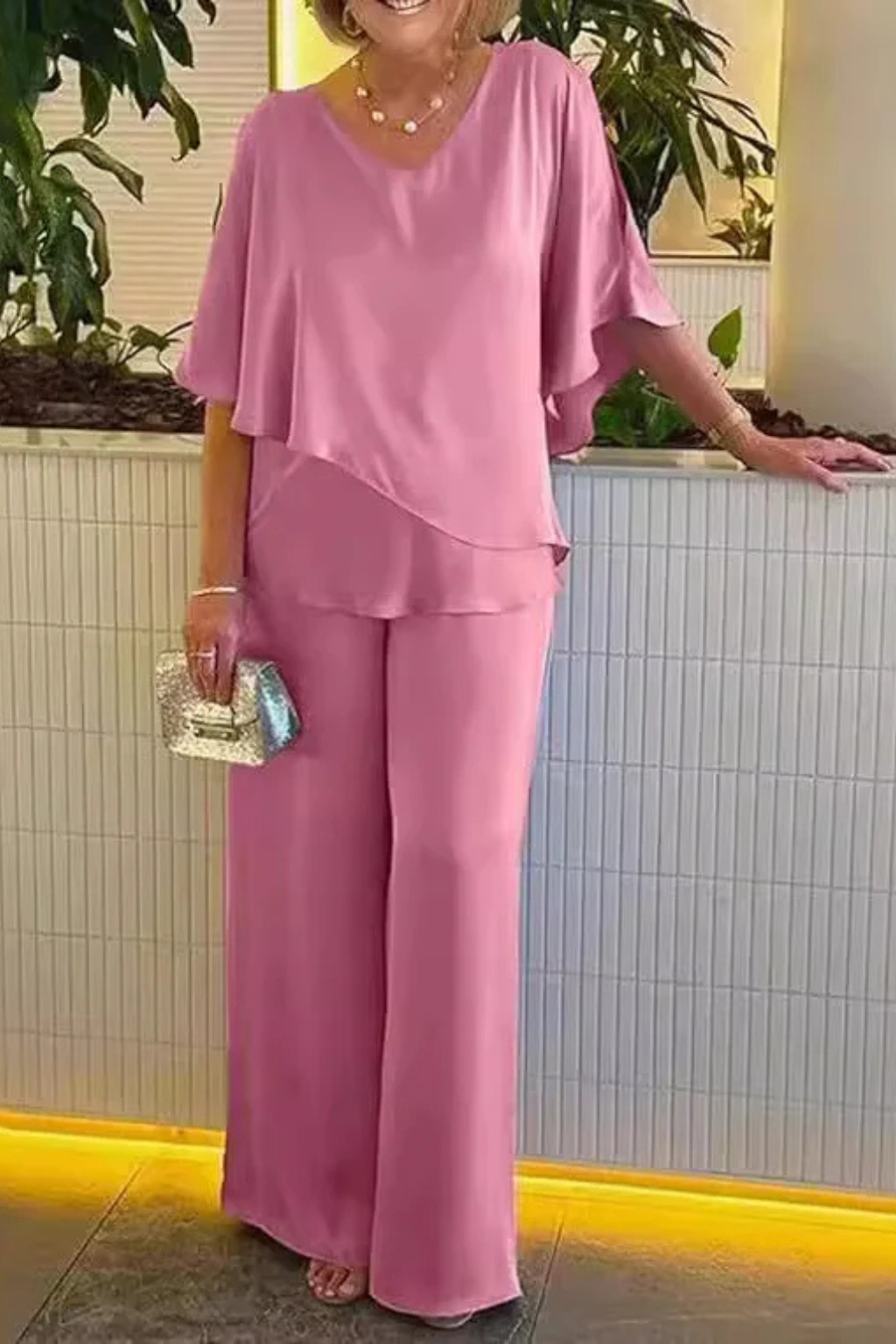 Chic women's two-piece set: batwing sleeve V-neck top with comfortable wide leg trousers. Elegant fashion.