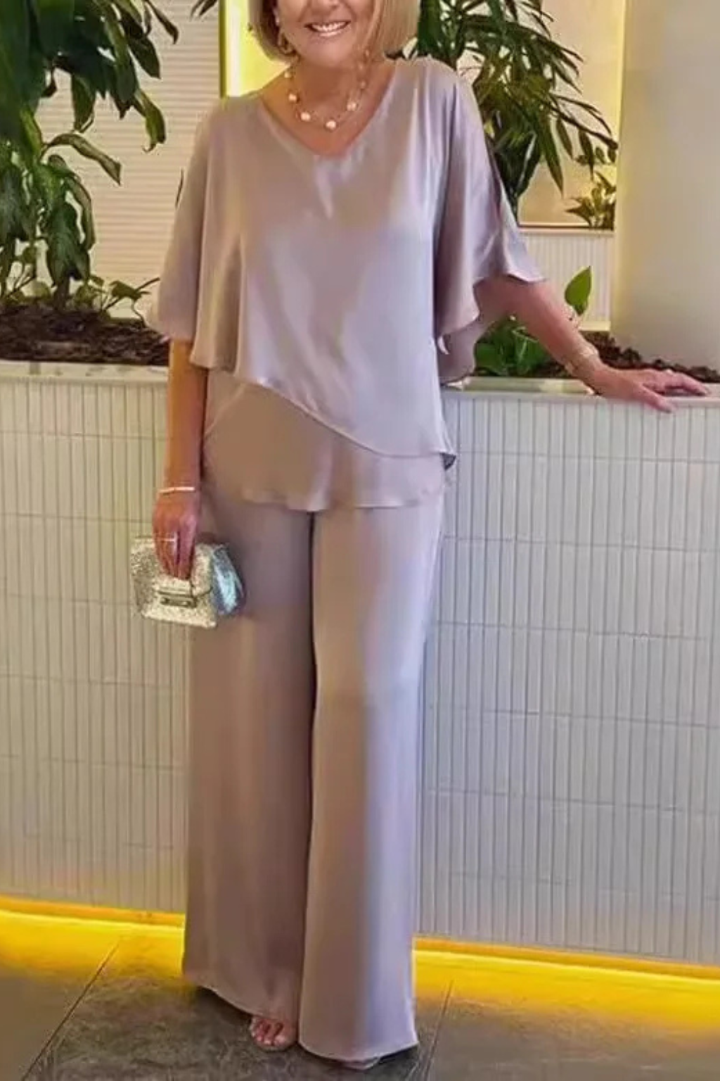 Luxurious feel women's two-piece set: elegant V-neck batwing top paired with comfortable wide leg pants.