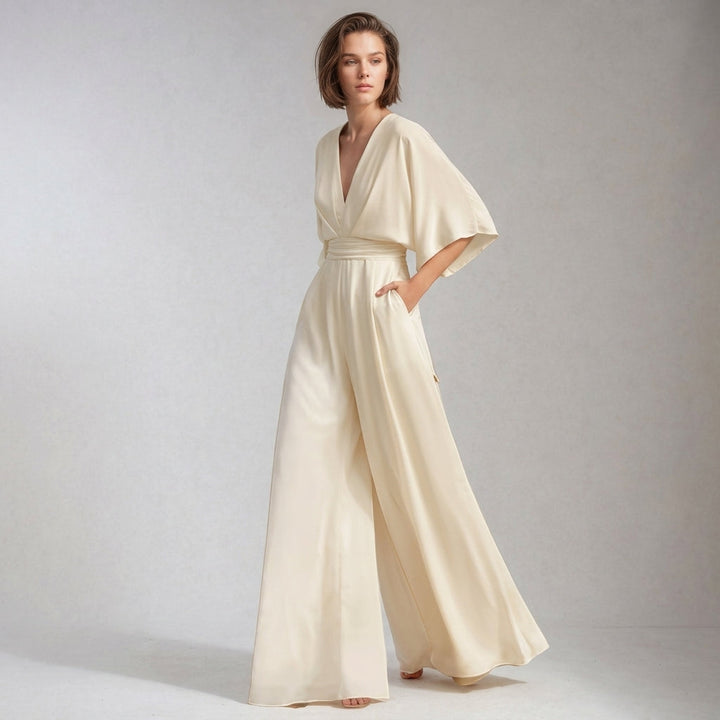 Women's flowing wide-leg V-neck jumpsuit, offering an elegant and comfortable fit. Versatile for stylish casual or formal fashion.