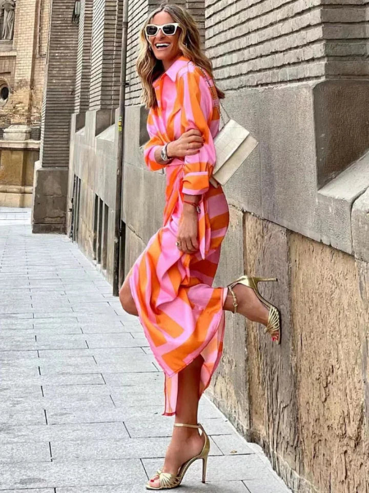 Flowing women's midi wrap dress with a comfortable tie waist. Versatile for casual chic or daytime wear.