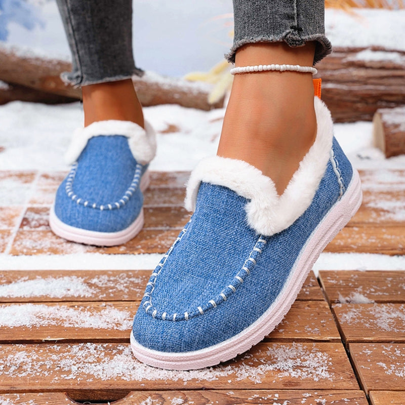 Close-up of a women's faux suede loafer showing soft fur lining and slip-on design