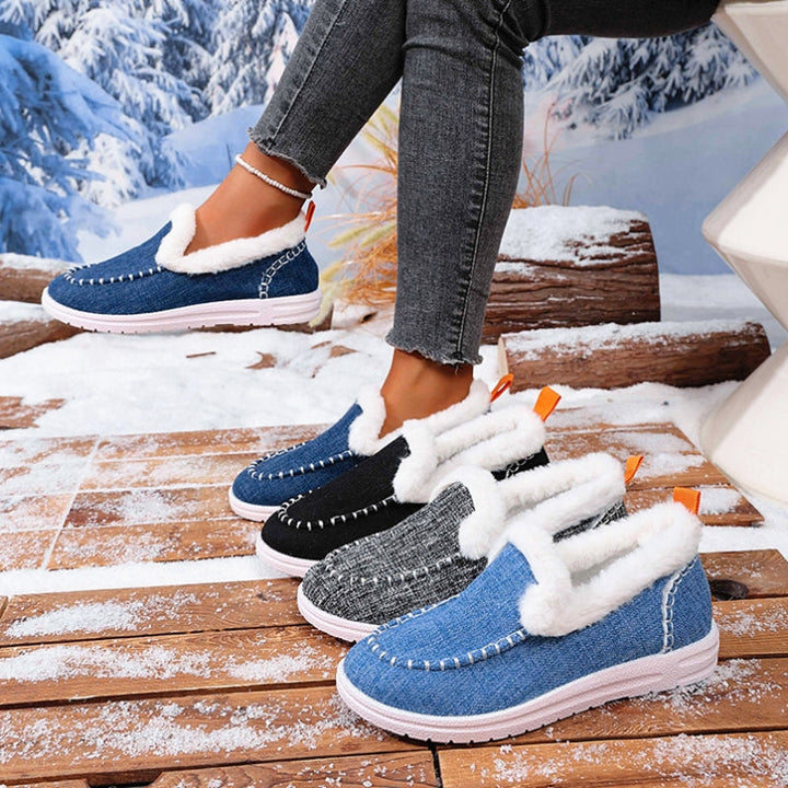 Pair of women's warm faux suede fur-lined slip-on loafers, excellent winter footwear choice