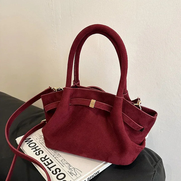 Detailed view of the faux leather texture on a women's vintage suede tote bag, fashion essential