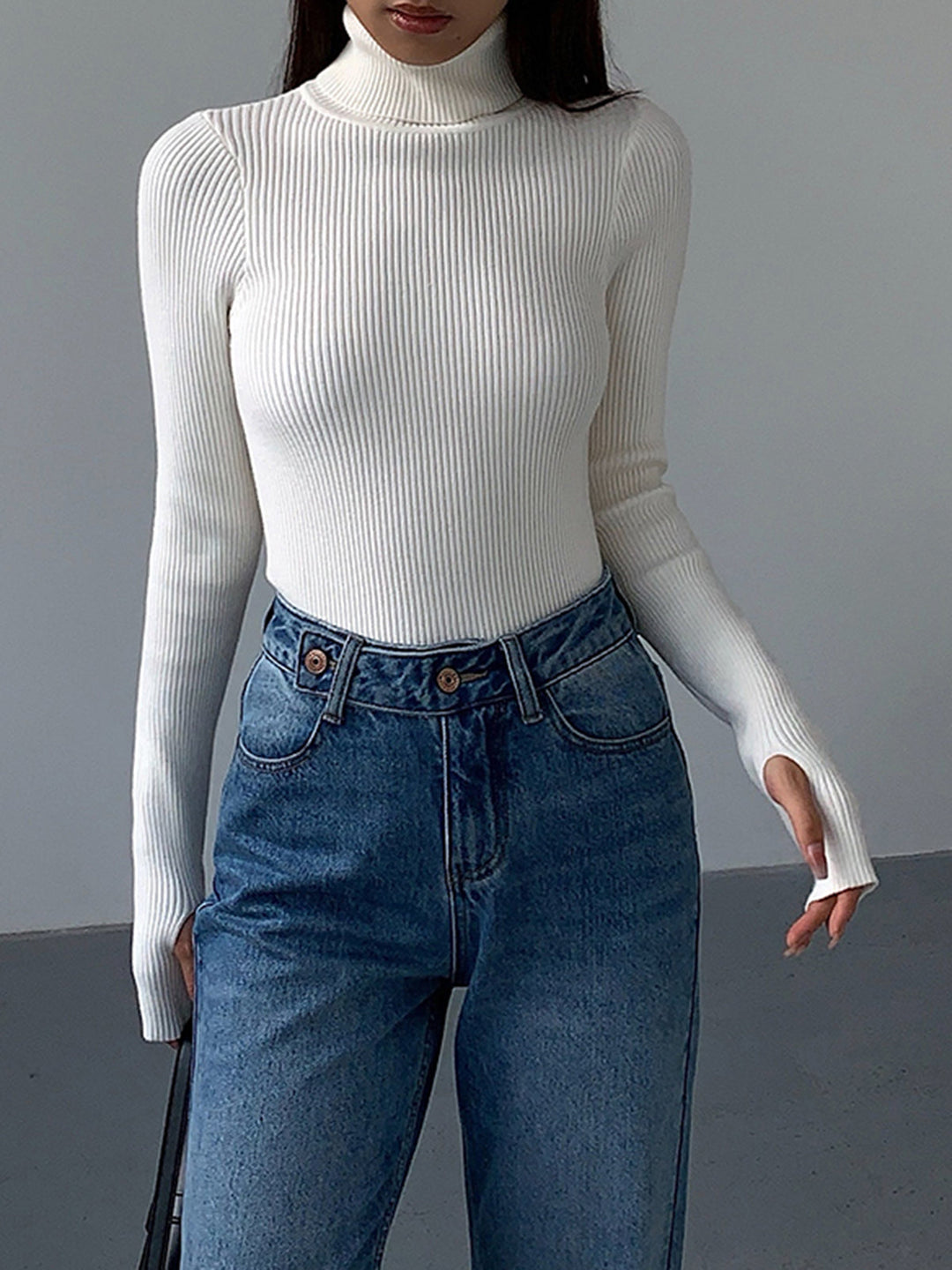 Women's long sleeve ribbed knit turtleneck sweater, designed for comfort and style during the spring season.
