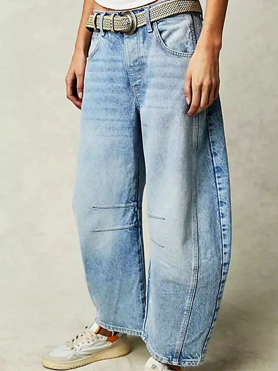 Relaxed fit women's high-waisted wide-leg jeans in denim, a stylish fashion staple.