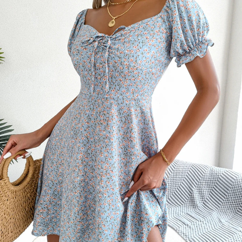 Detail of the floral print on a women's A-line summer dress with ruffle accents