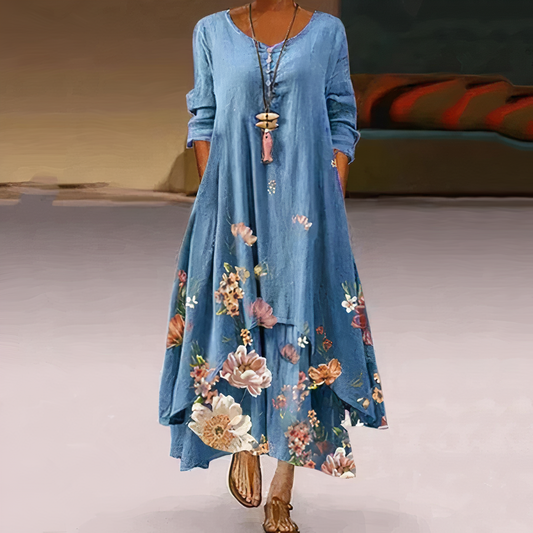 Flowy women's long sleeve maxi dress with vibrant floral border print, ideal for spring casual.