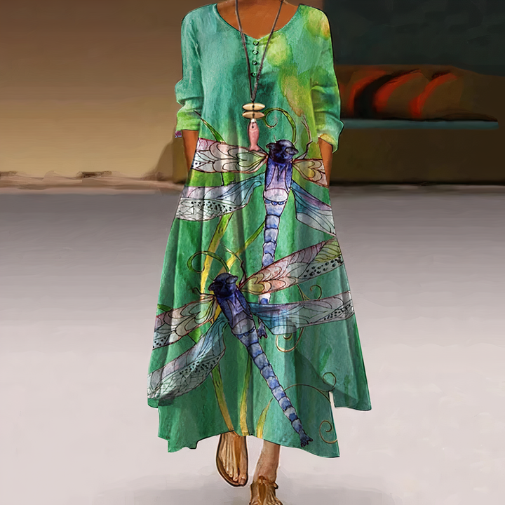 Stylish women's long sleeve maxi dress with an eye-catching floral border print, boho aesthetic.