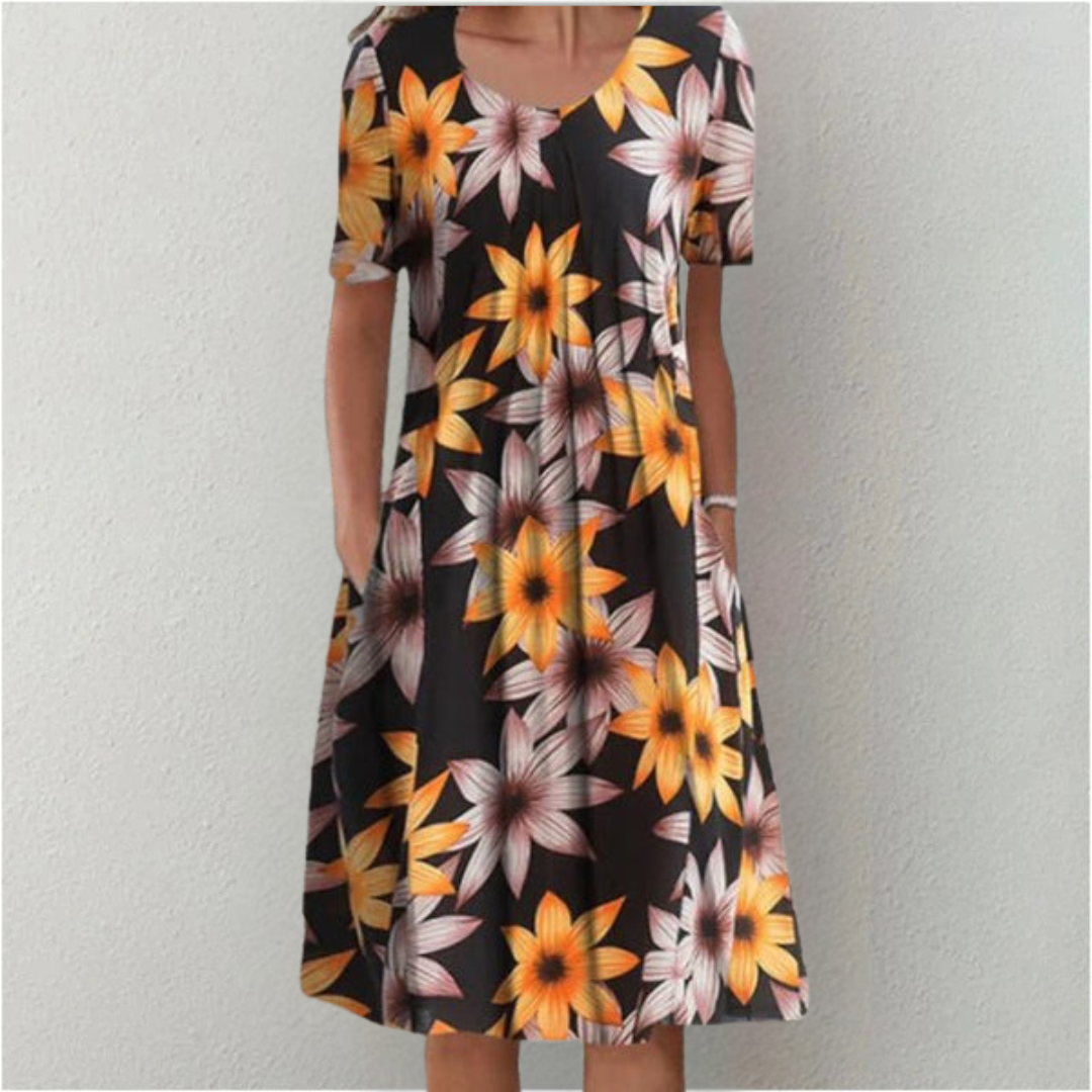 Women's A-line floral casual dress. Midi length with short sleeves, round neck, and convenient pockets for daily wear.