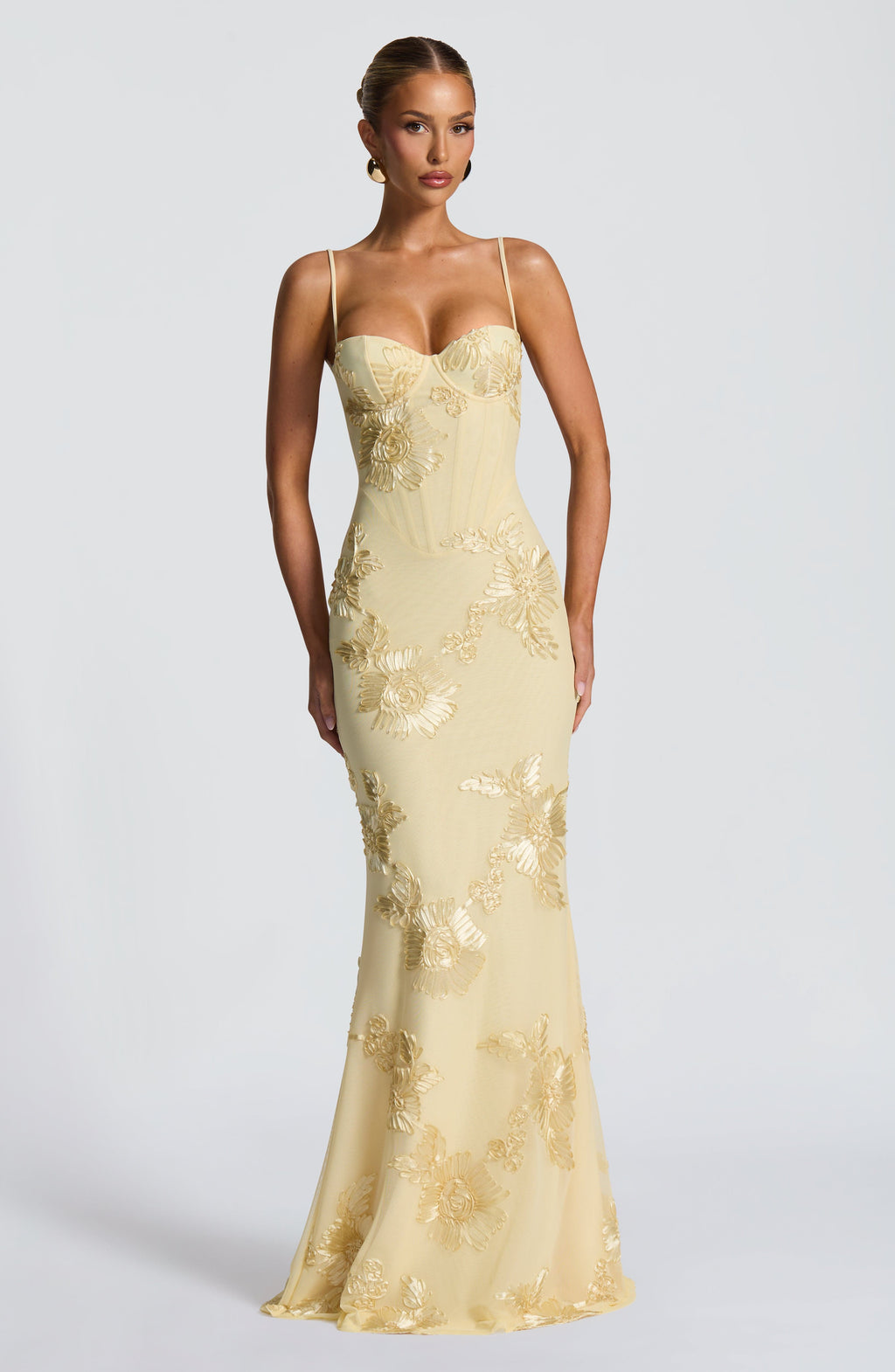 Women's floral corset maxi dress for wedding guests. Elegant spaghetti strap formal occasion wear.