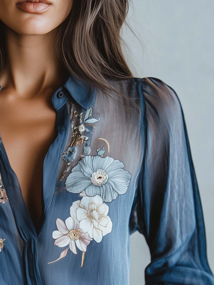 Women's relaxed fit blouse, floral embroidery, sheer sleeves, v-neck, perfect for evening wear.