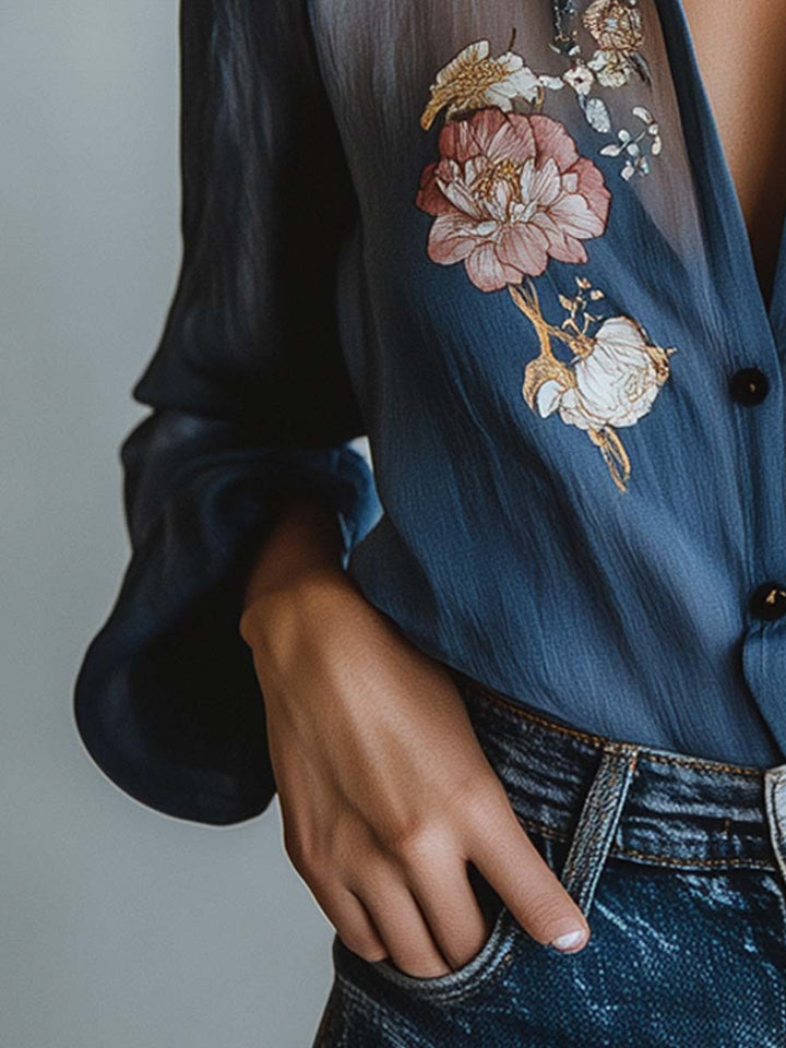 Stylish women's top: Floral embroidered blouse with delicate sheer sleeves and a v-neck.