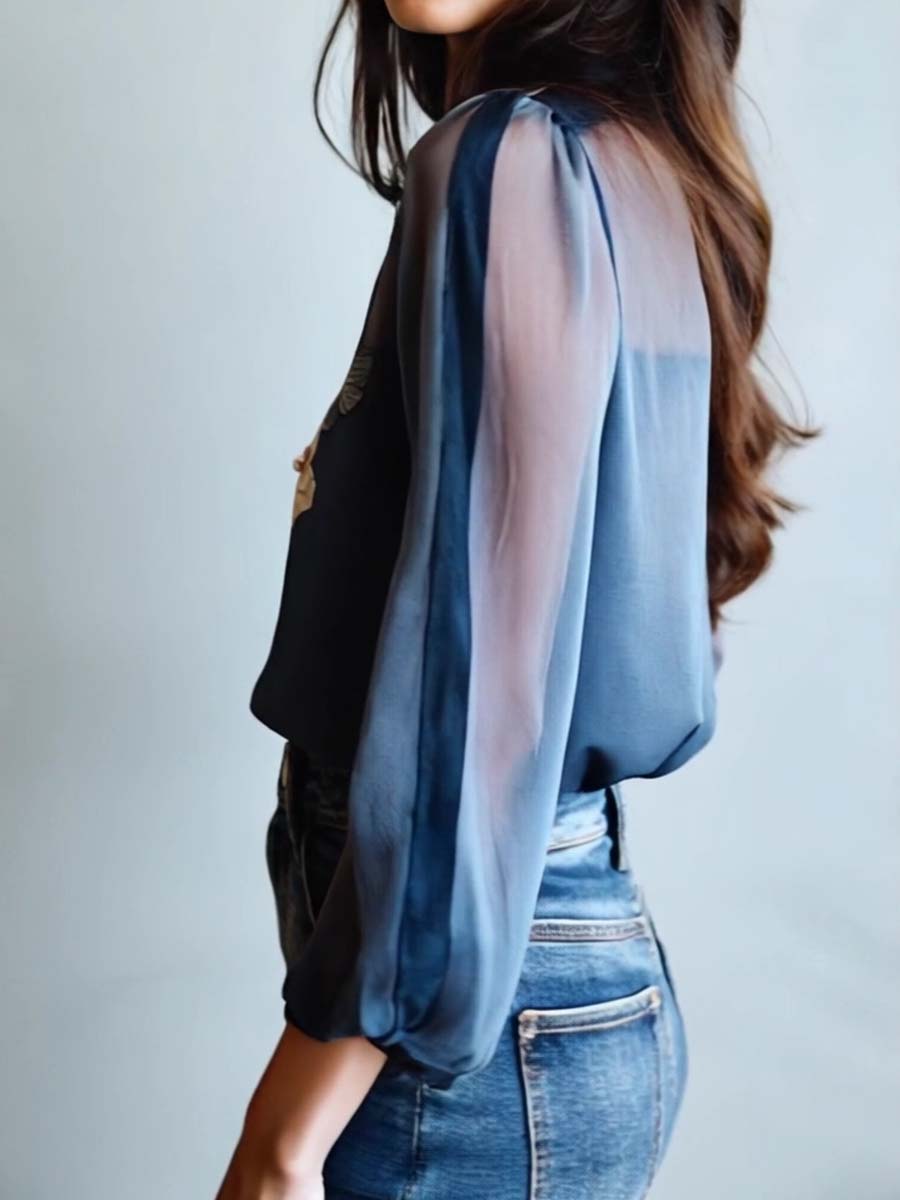 Relaxed fit women's blouse, floral embroidery, sheer sleeves. A versatile, stylish shirt.