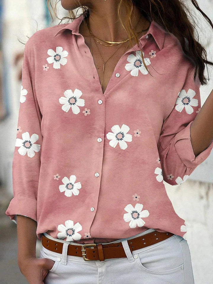 Women's floral print button-front blouse with long sleeves, perfect for elegant casual wear or work. Relaxed fit top.
