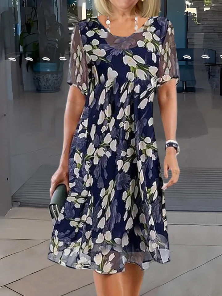 Women's floral print midi dress, short sleeve, round neck, A-line cut. Perfect for summer casual wear.