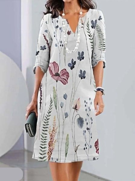 Elegant women's floral midi dress with short sleeves & round neck. Comfortable A-line silhouette for everyday wear.