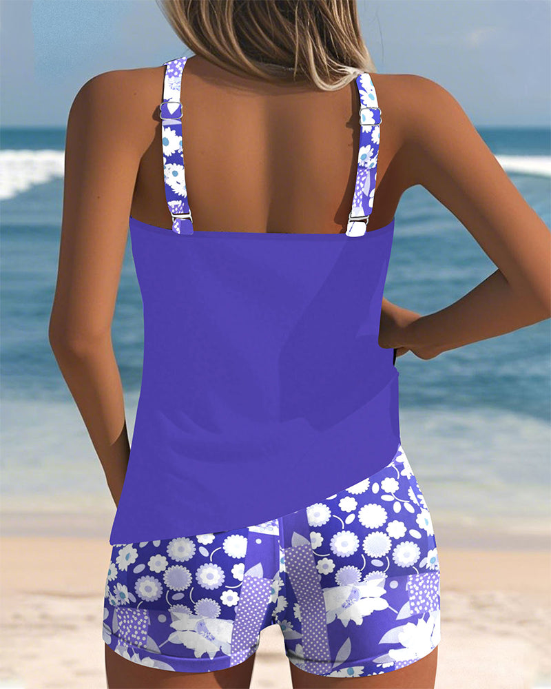 Active women's floral tankini & boyshort set. Perfect for swimming, beach sports, and summer fun.