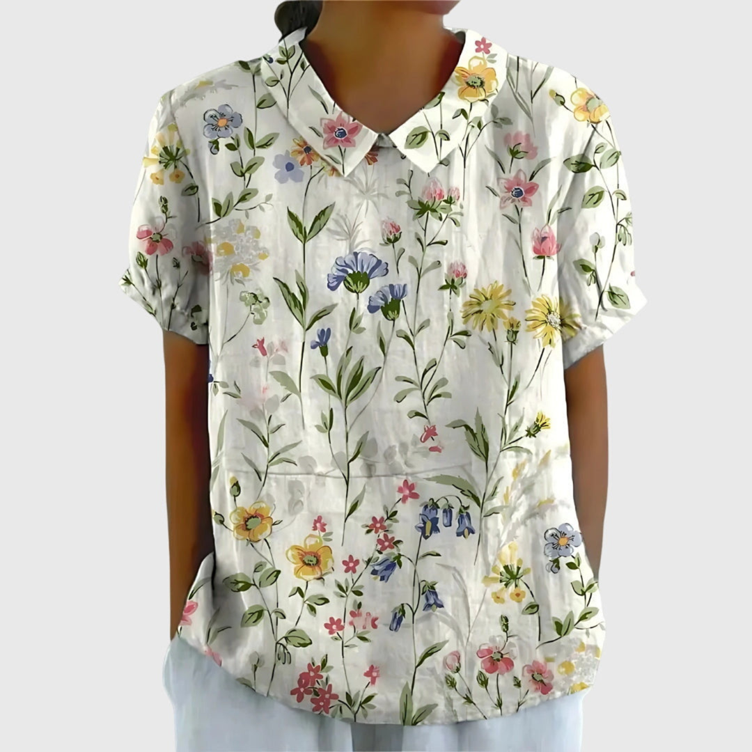 Women's floral print short sleeve collared blouse for elegant summer style.