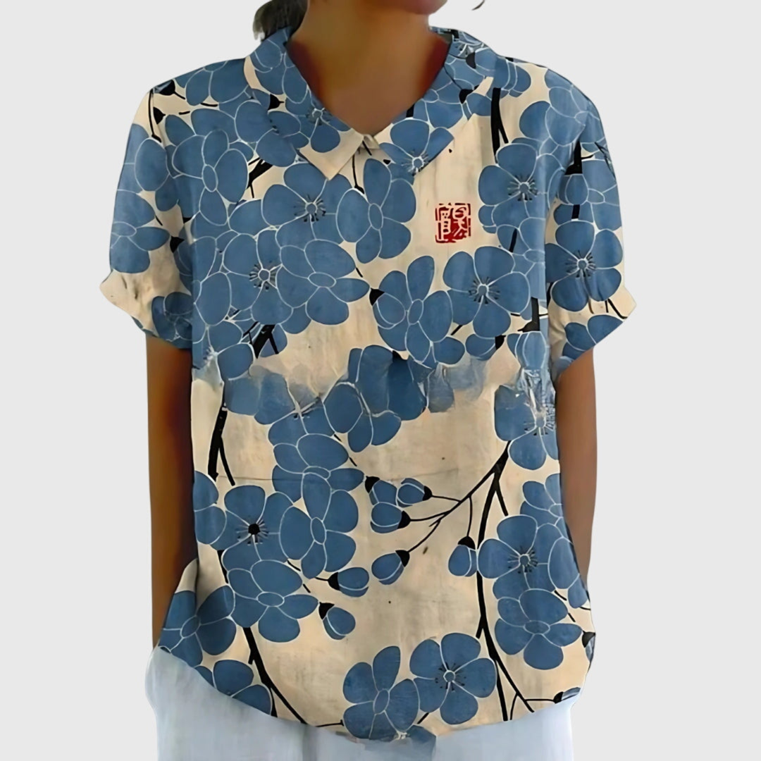 Women's floral print short sleeve collared blouse. A stylish Peter Pan collar top for spring/summer.