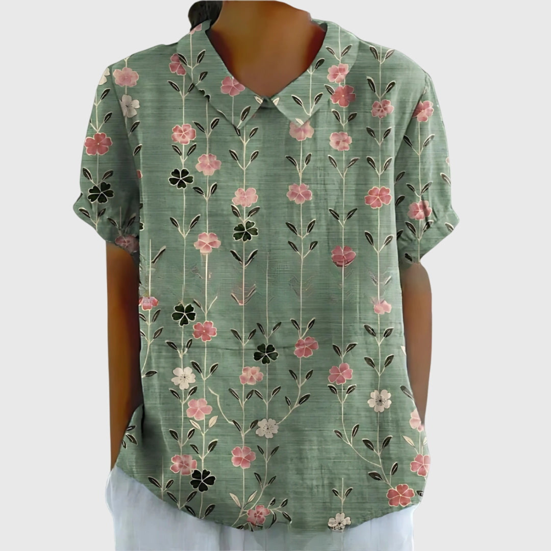 Women's floral print short sleeve blouse featuring a charming Peter Pan collar, perfect for spring.