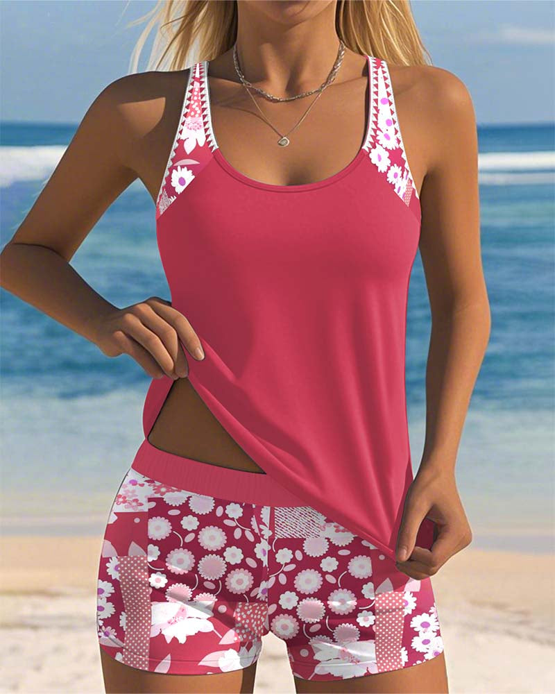 Women's floral tankini swimsuit set with matching shorts. Stylish two-piece beachwear for summer vacation.