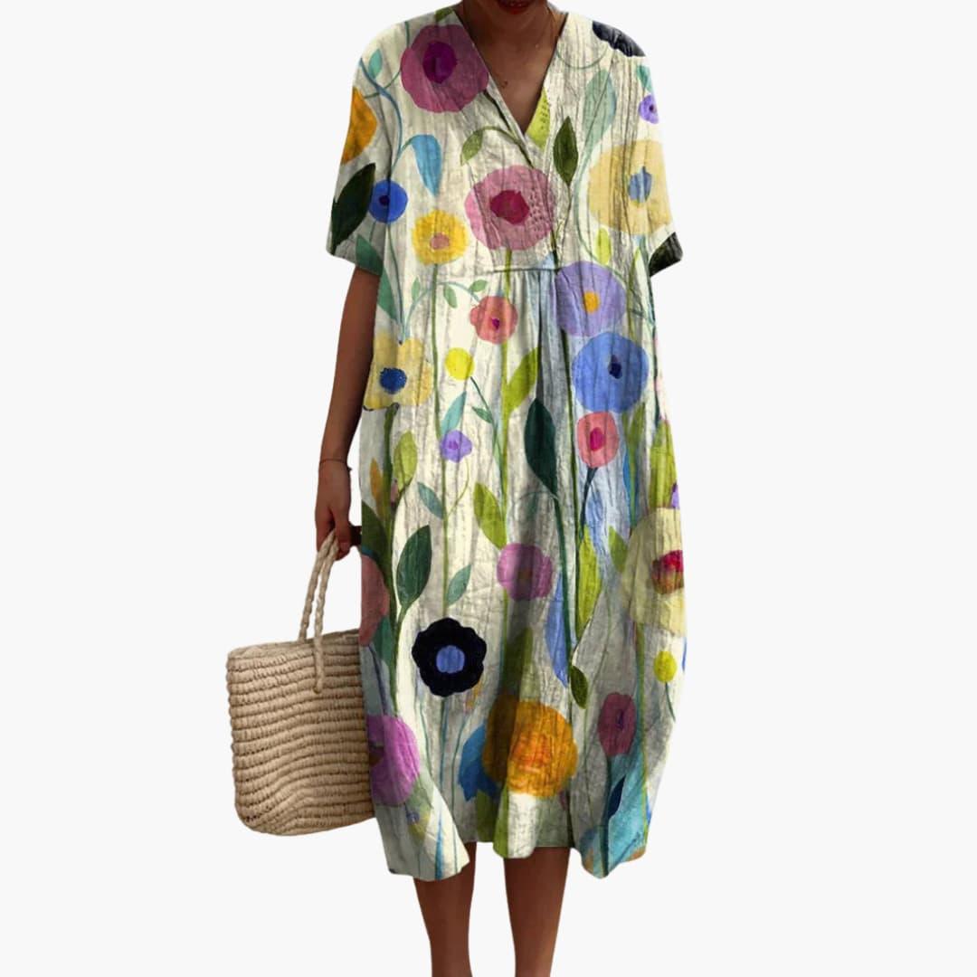 Elegant floral print midi dress for women, V-neck, short sleeves, and relaxed oversized silhouette. Easy care.