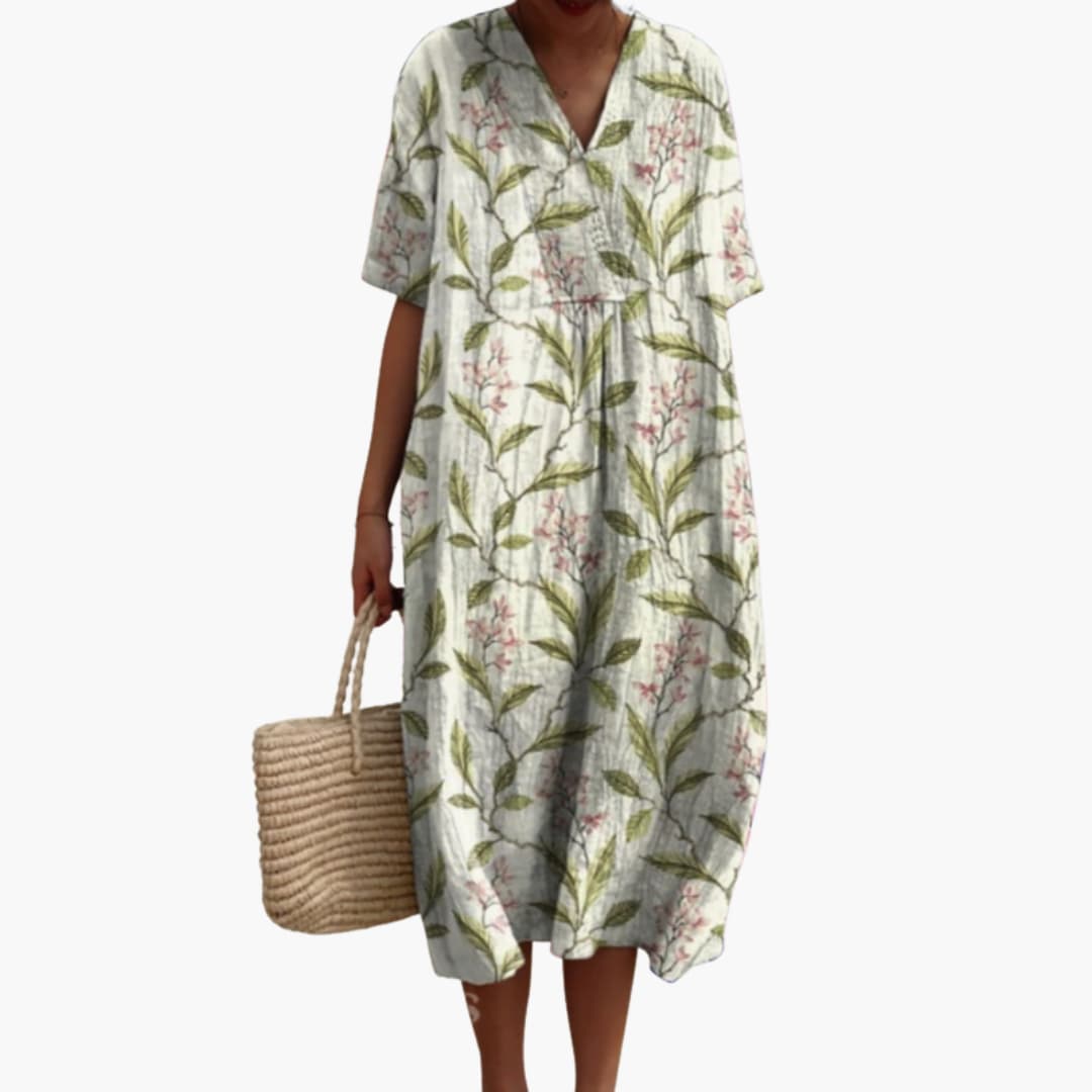 Front view of a women's floral V-neck short sleeve oversized midi dress, ideal for casual summer days.