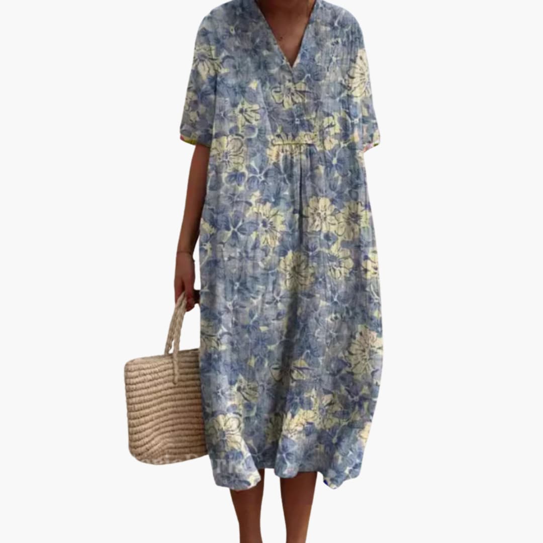 Side view of a flowy women's floral midi dress, V-neck and short sleeves. Comfortable, oversized fit.