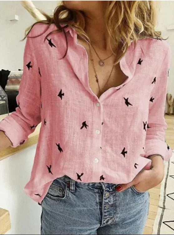 Boho chic women's blouse featuring a vibrant floral print and vintage-inspired design. Ideal for everyday wear.
