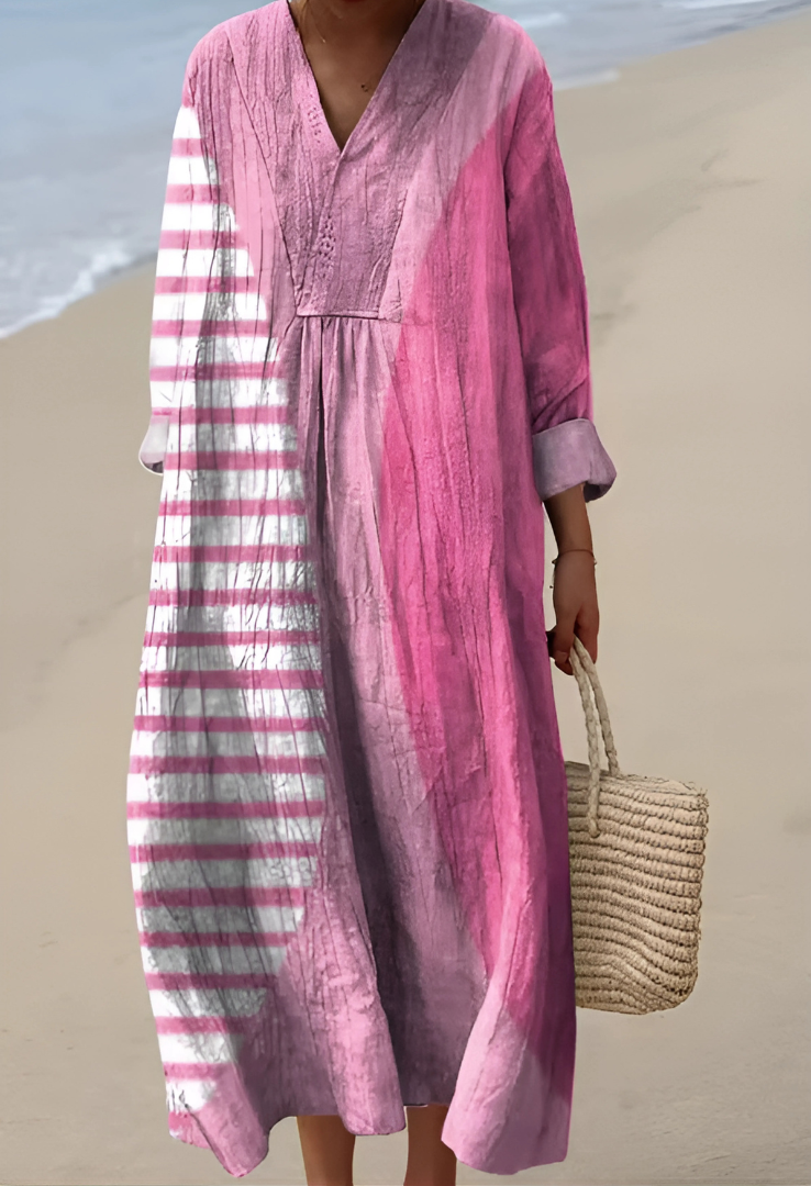 Women's flowing abstract V-neck dress with unique pattern, ideal for stylish casual summer wear, day to night comfort.
