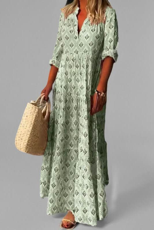 Vacation-ready women's elegant flowing tiered maxi dress, suitable for warm weather.