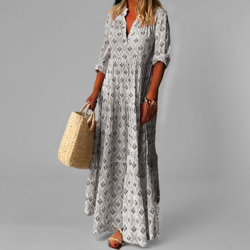 Flowing women's tiered V-neck maxi dress. Comfortable long sleeve design, ideal for casual and summer days.