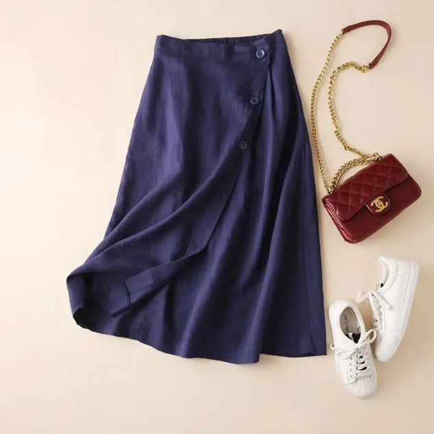 Women's flowy A-line midi skirt with a graceful drape, perfect for elegant spring & summer casual wear.