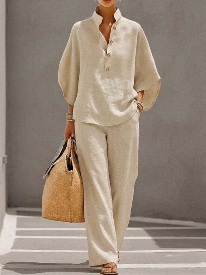 Women's flowy batwing blouse and wide leg trousers coordinating set. Comfortable & stylish two-piece outfit.