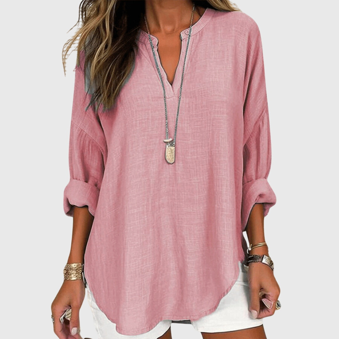 Elegant women's flowy long sleeve shirt, a comfortable beach top perfect for resort wear and summer style.
