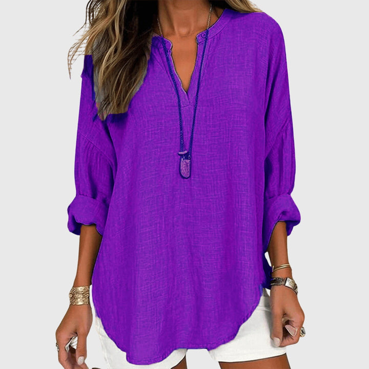 Stylish women's long sleeve flowy top, an elegant beach shirt ideal for chic casual wear & summer comfort.