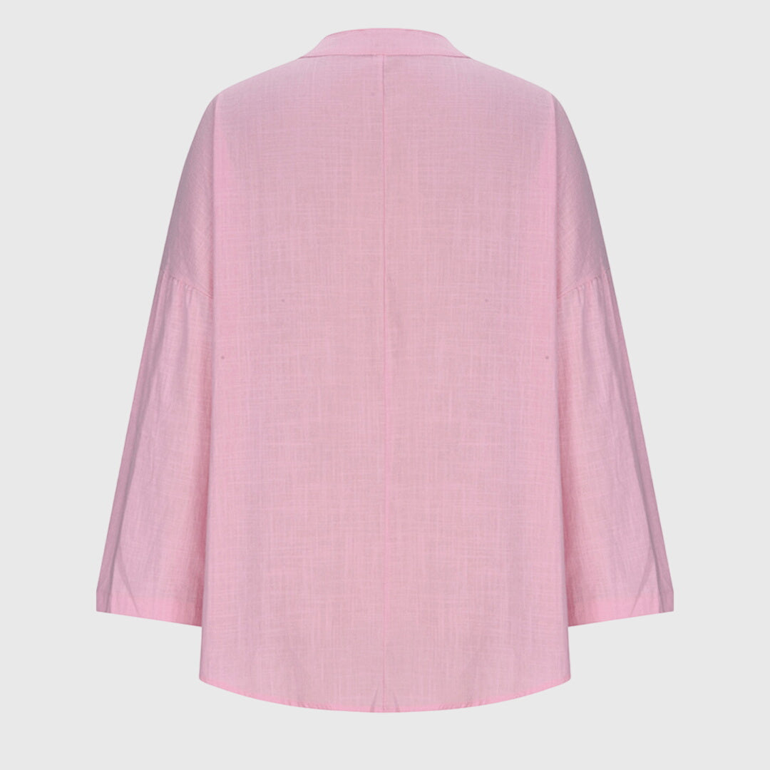 Women's elegant flowy long sleeve beach shirt, a comfortable and chic top for summer style & resort wear.