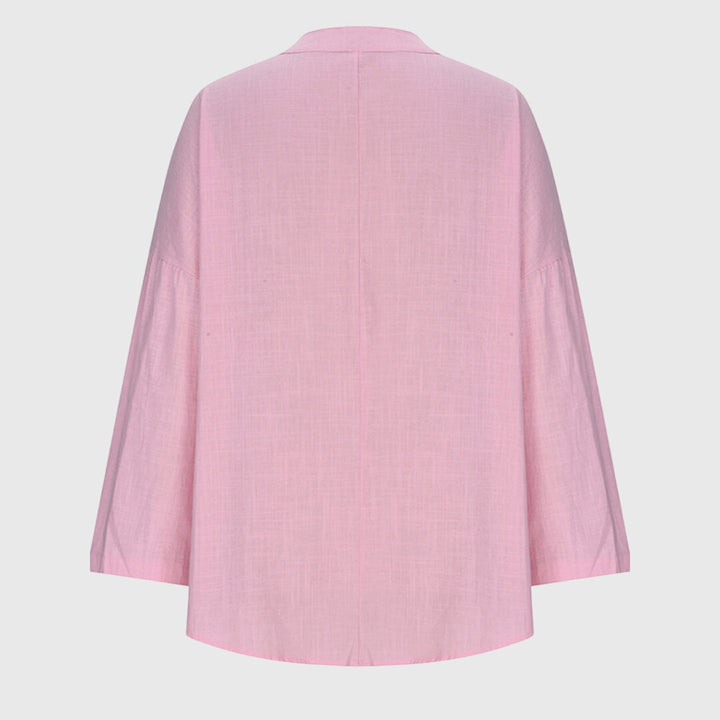 Women's elegant flowy long sleeve beach shirt, a comfortable and chic top for summer style & resort wear.