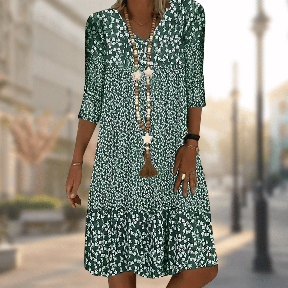 Vibrant floral print tiered summer dress for women, featuring a flowy silhouette, V-neck, and 3/4 sleeves.