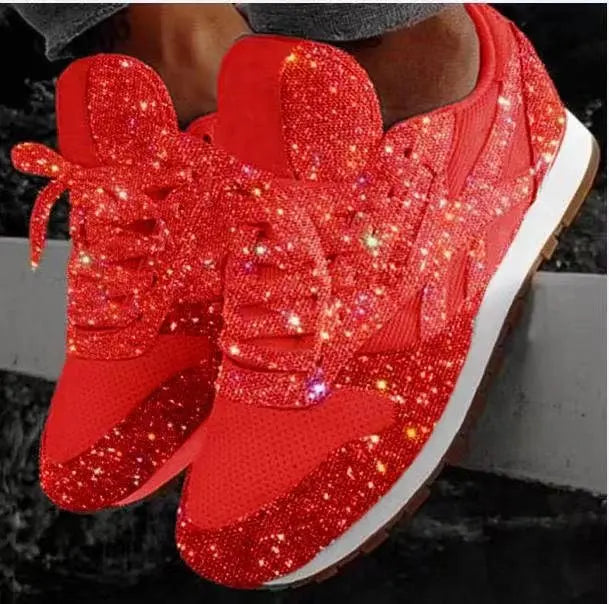 Side view of women's fashionable glitter lace-up sneakers. Shimmering and comfortable for trendy casual style.