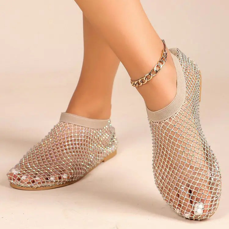 Glamorous women's glitter flats, secure instep strap, ideal for any elegant occasion.