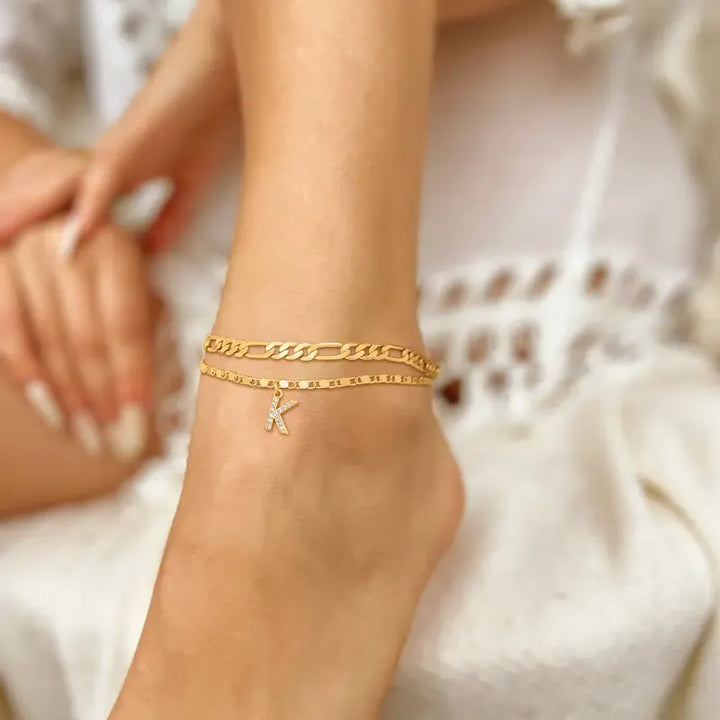 Elegant women's gold initial 'Z' anklet with a shimmering crystal, personalized fashion accessory